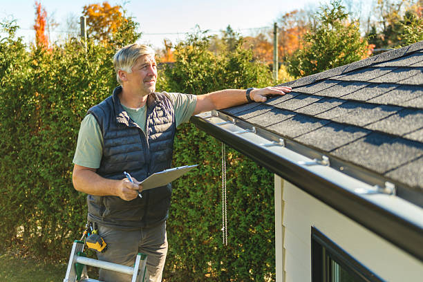 Professional Storm Damage Roof Repair technician working in Clearfield, UT